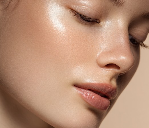 Side profile of a face with glowing skin